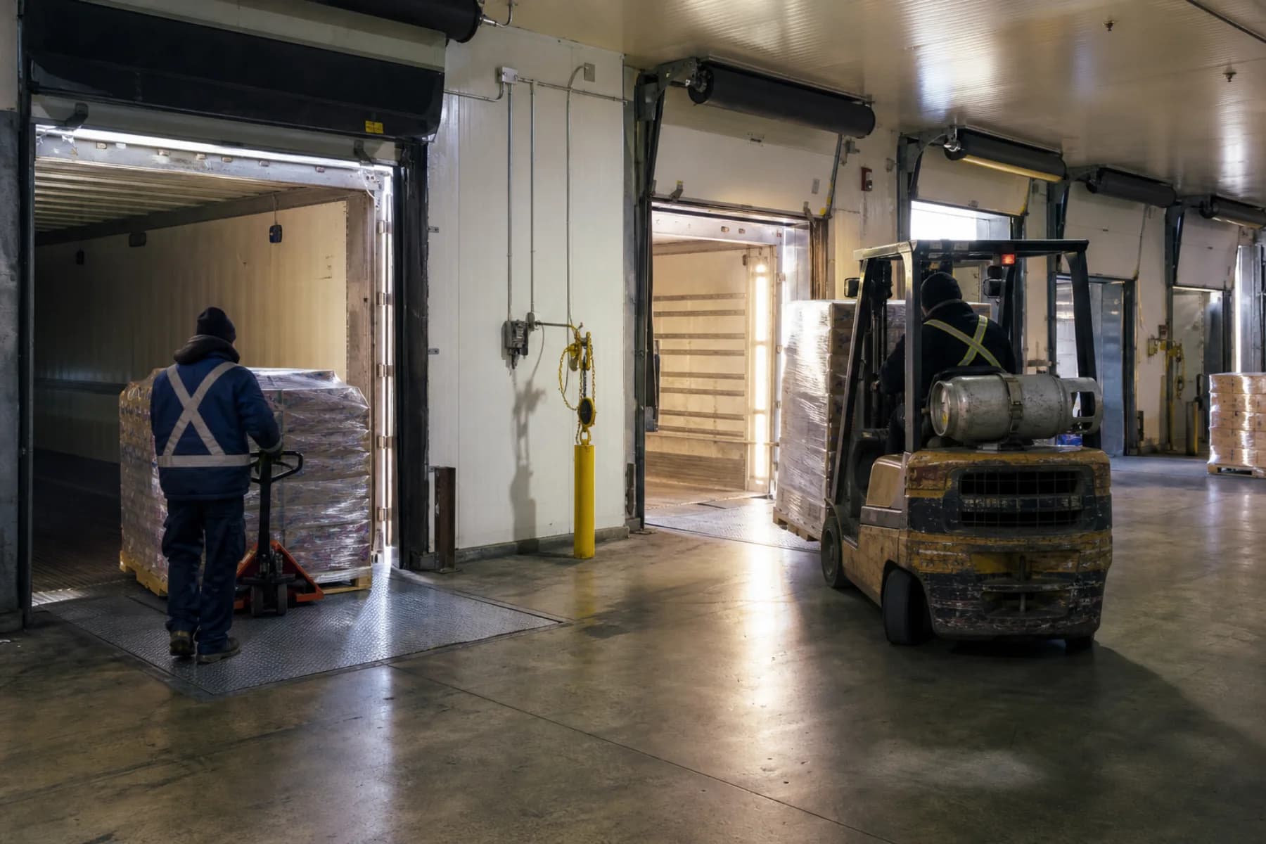 Palletized freight moving through a working cross-dock