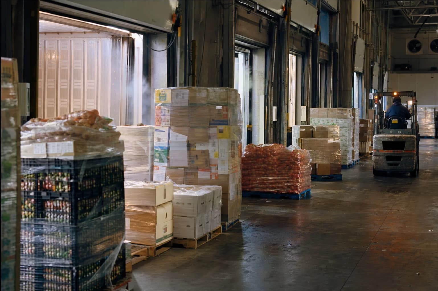 Mixed palletized refrigerated freight staged for LTL consolidation